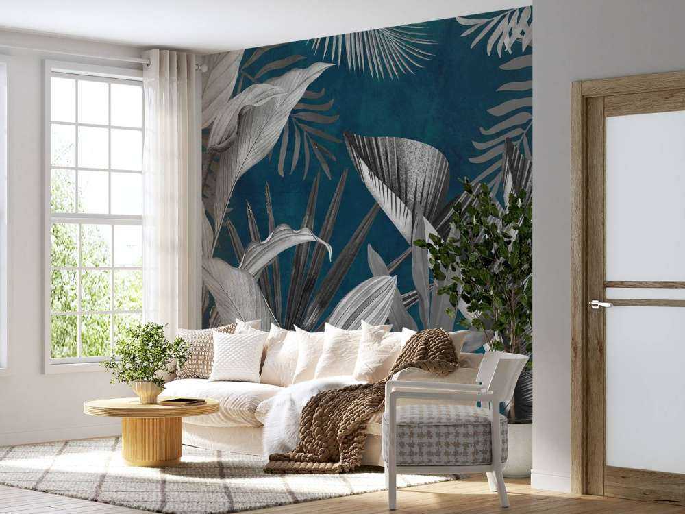 Tropische Blätter auf blauem Hintergrund