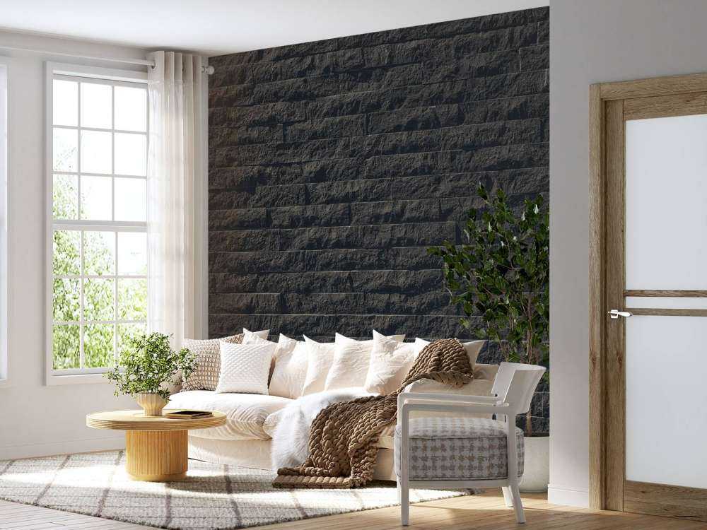 Mauer mit dunklen Steinen